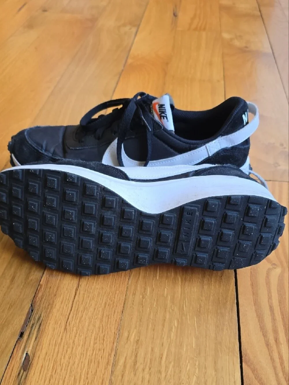 Nike Waffle Debut sneakers featuring a black nylon and suede upper with a white